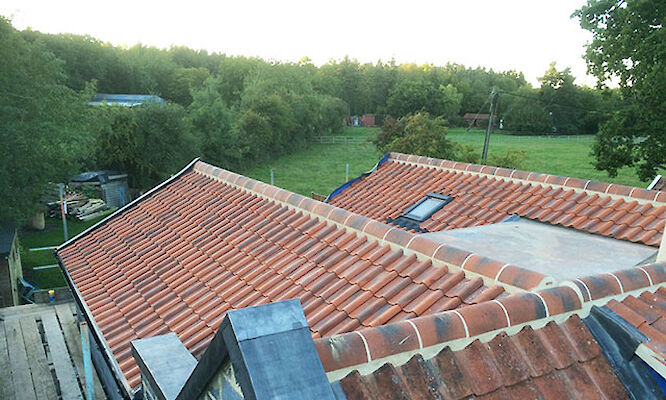 Roofer in Norwich completing tiled roof repairs